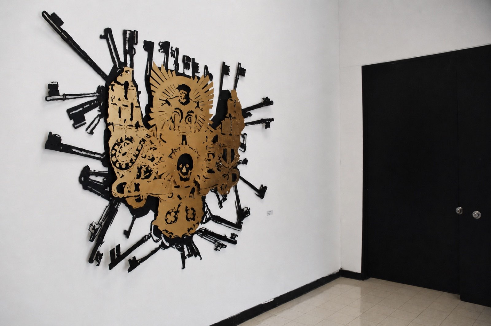 Event Horizon installed — gilded iconography ringed by cut-steel arms on a gallery wall