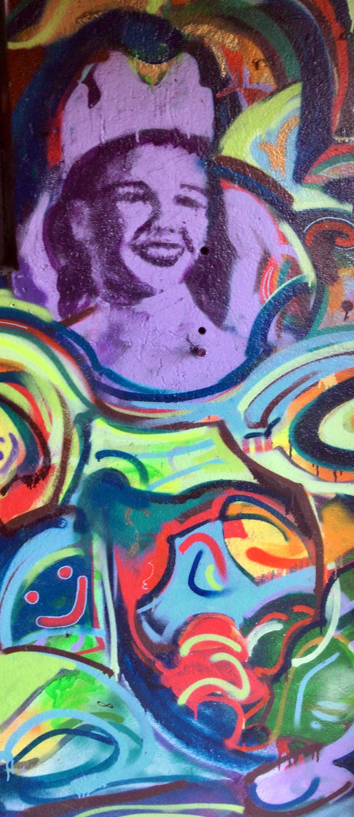 Grandmother mural in lavender — photo-real portrait inside spray abstraction